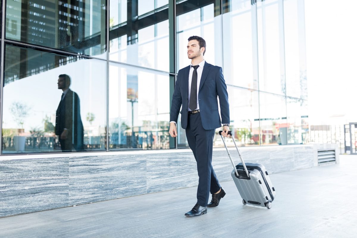 a corporate travel with suitcase